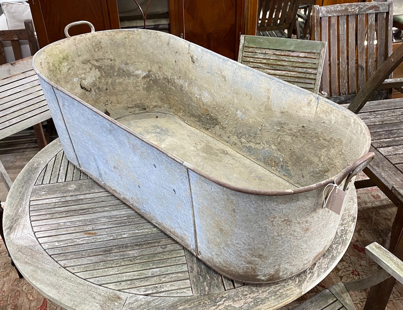A large galvanised two handled trough, length 127cm, height 39cm